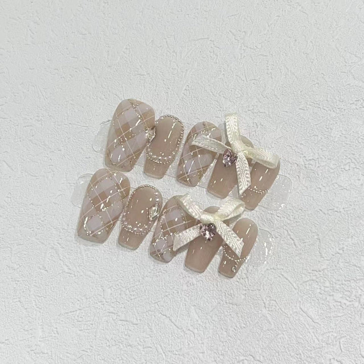 Elegant Press-On Nail Art Set with Ribbons and Gemstone Accents Stornfield
