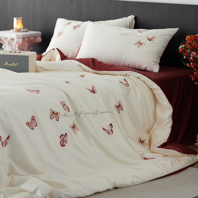 Luxurious cotton satin duvet cover set with embroidered butterfly designs and reversible design