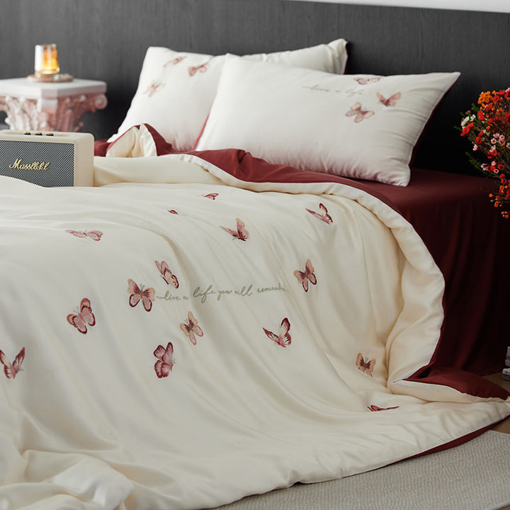 Luxurious cotton satin duvet cover set with embroidered butterfly designs and reversible design