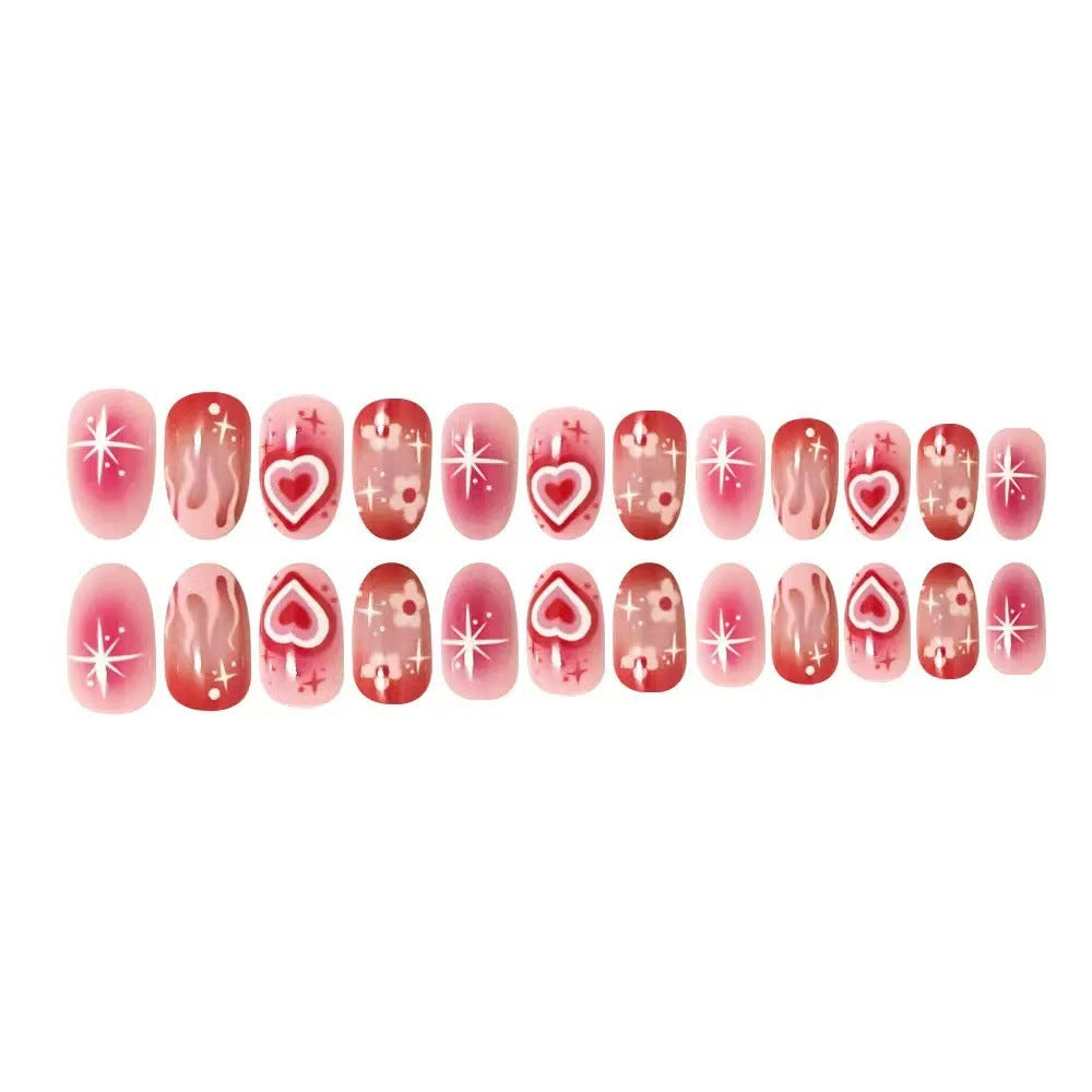 Artificial nail set with romantic heart design and sparkling accents Stornfield