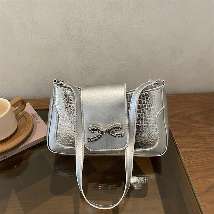 Elegant Crocodile-Patterned Handbag with Bow Detail
