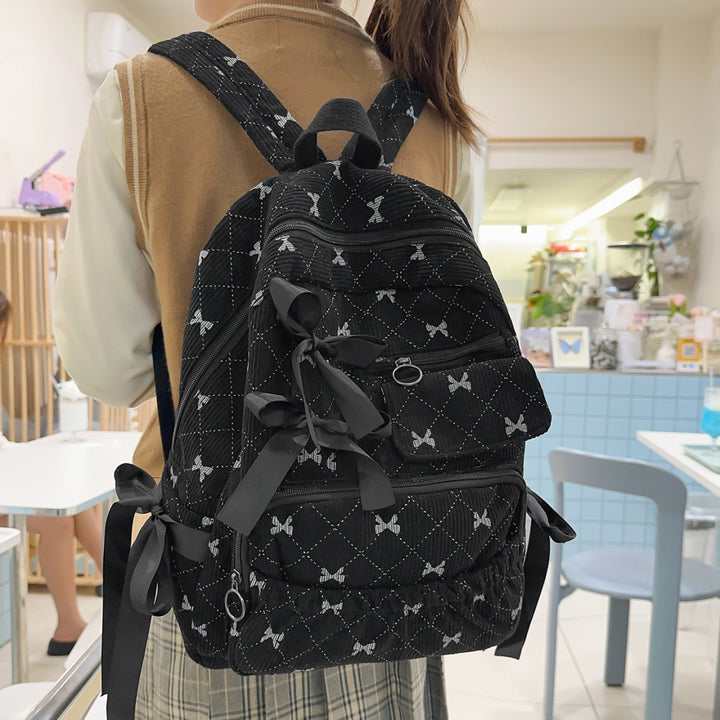 Playful backpack with bow details and practical compartments Stornfield