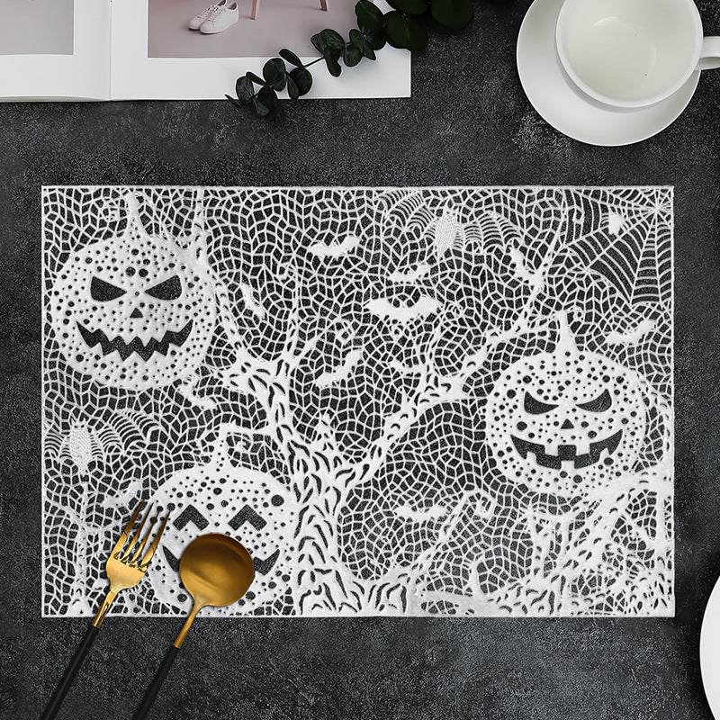 Halloween plastic table mats with intricate pumpkin and spider web design