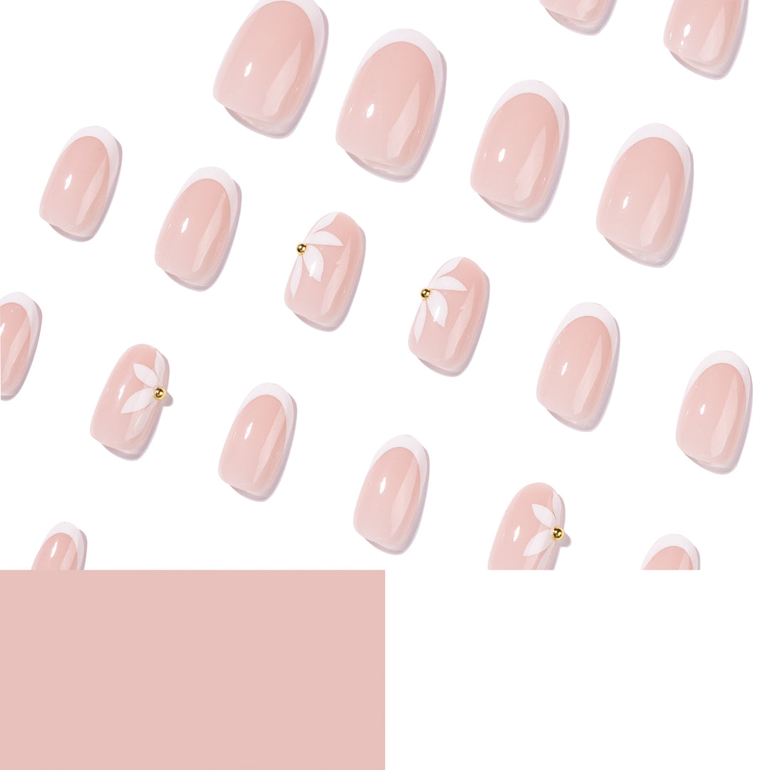 Artful French nails with delicate flowers and glitter accents Stornfield