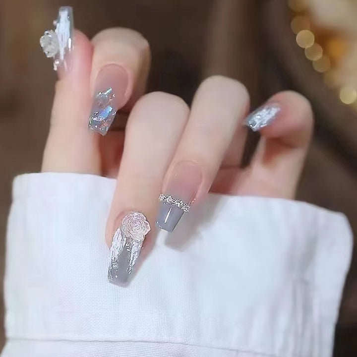 Artificial nail set with delicate rose and glitter decorations Stornfield