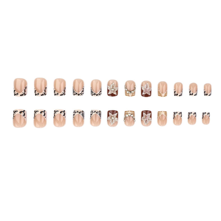 Artificial nail set with floral embellishments and elegant glitter details Stornfield