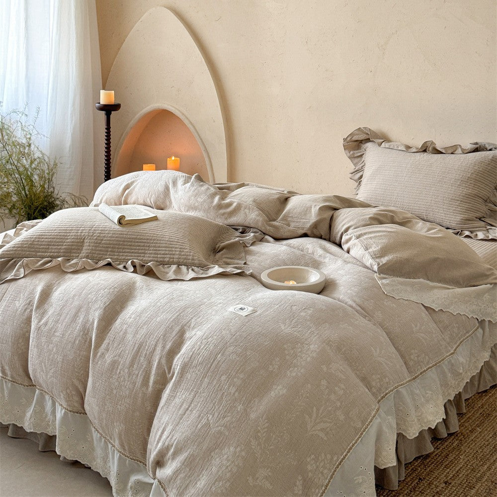 Luxurious quilted cotton bedding set with ruffles and embroidered details