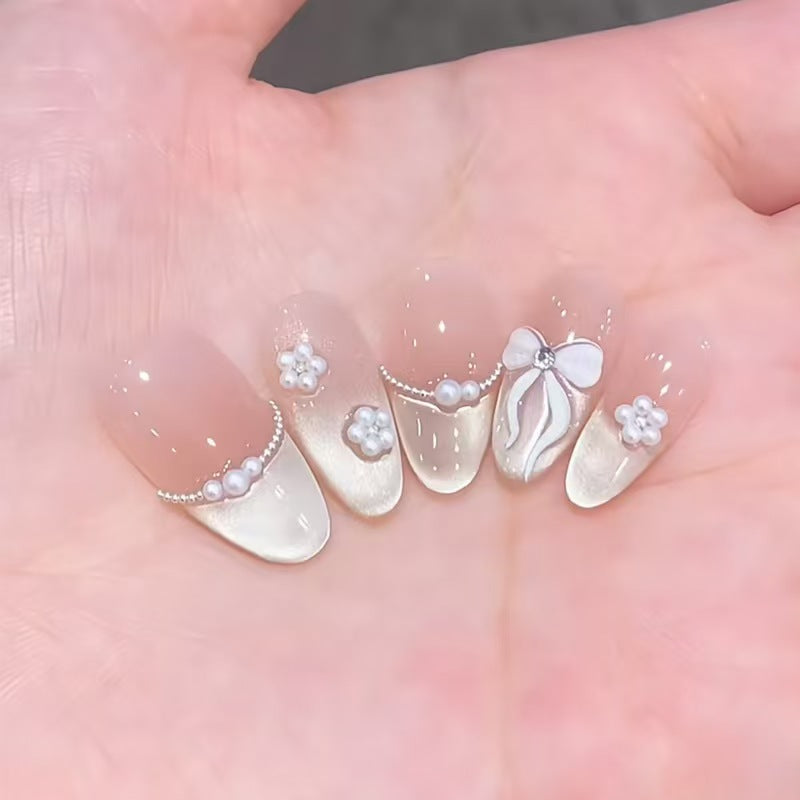 Artificial nails with elegant, adorned tips Stornfield