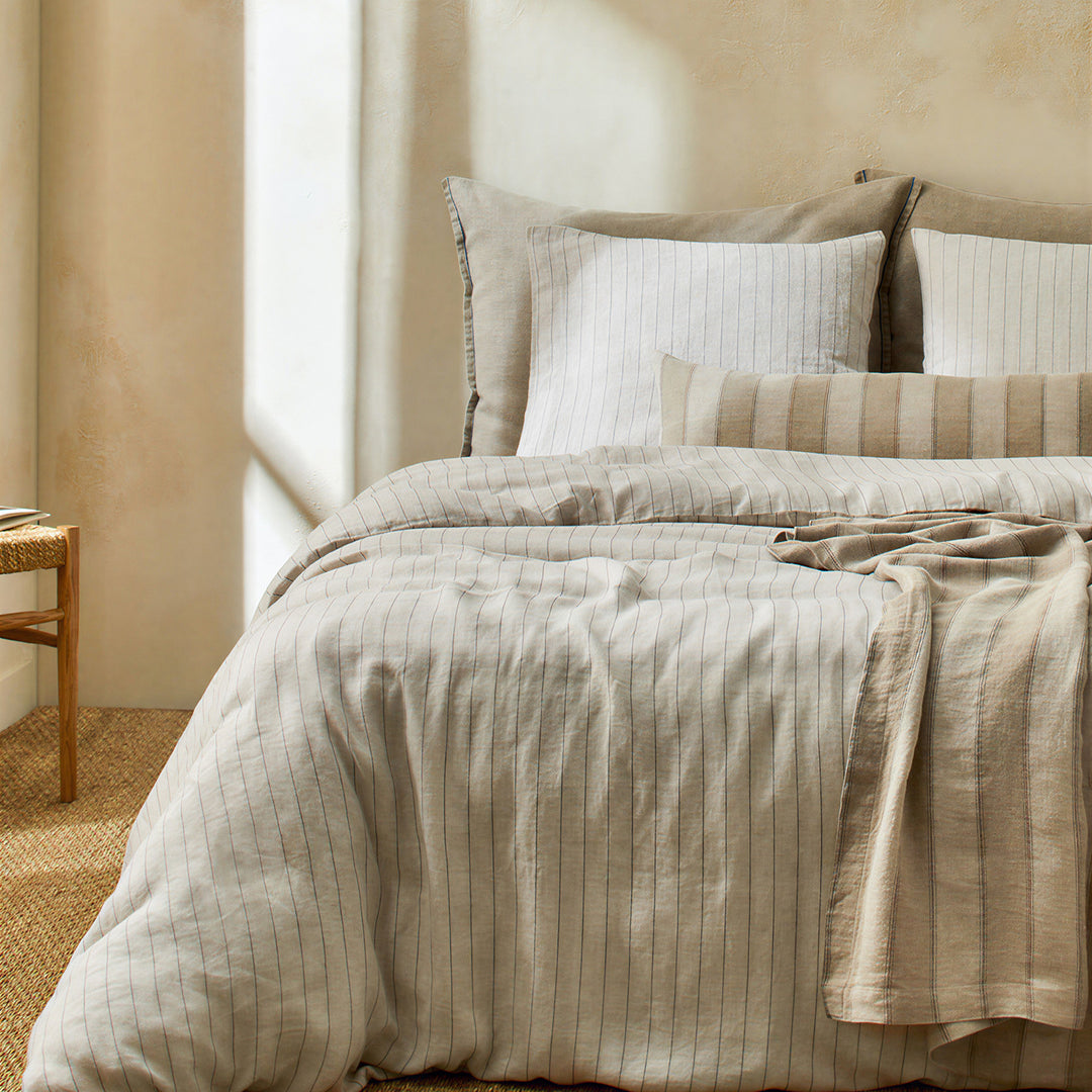 Linen bedding set with fine pinstripes and reversible function