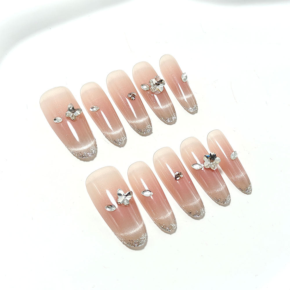 Glamorous artificial nails with rhinestone decorations Stornfield