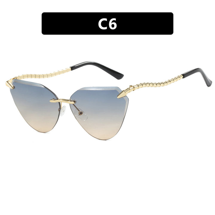 Women's Cat-Eye Sunglasses with unique gold frame design and protective lenses Stornfield