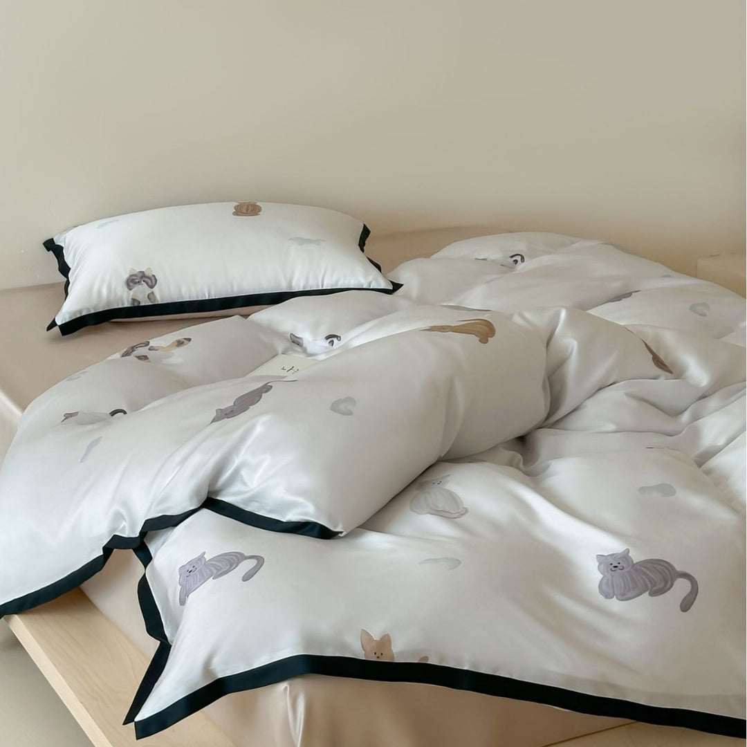 Silk-gloss satin bedding set with minimalist cat illustrations and fine piping