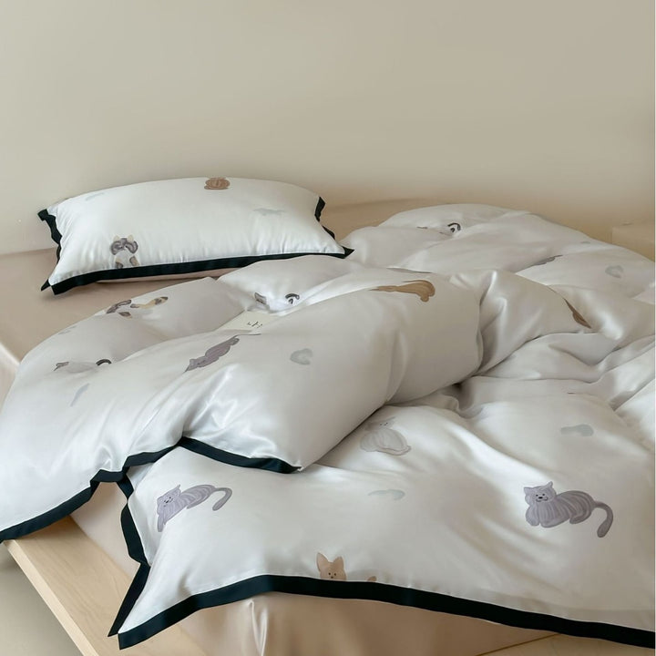 Silk-gloss satin bedding set with minimalist cat illustrations and fine piping