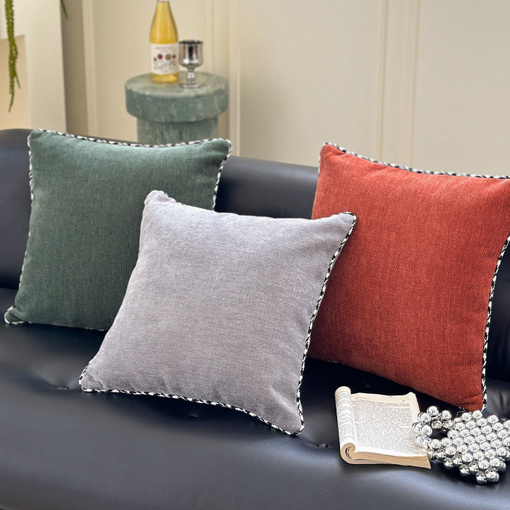 Decorative square decorative pillow made of soft velvet with contrasting piping
