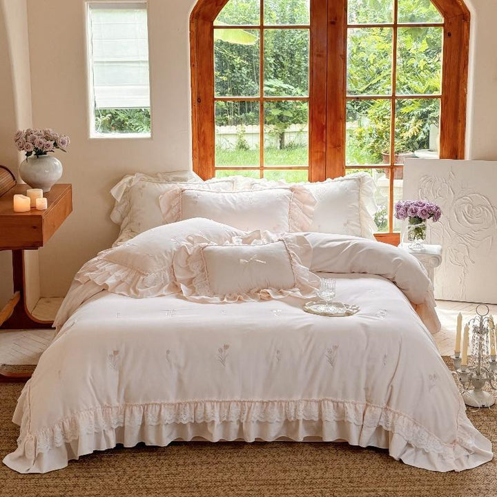 Romantic cotton bedding set with ruffles and delicate floral embroidery