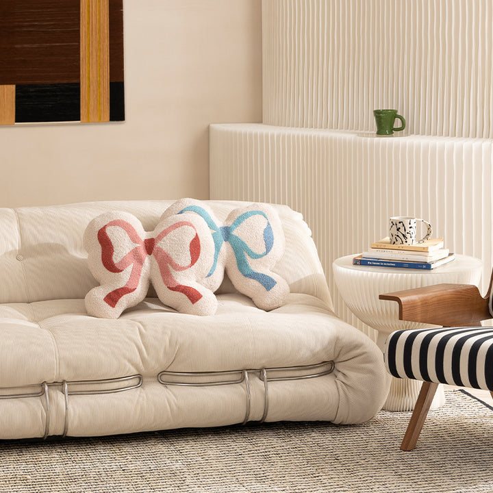 Bow decorative cushion made of boucle with fluffy teddy look