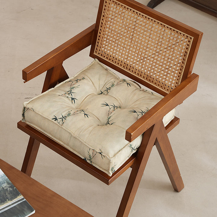Padded seat cushion with tufting and bamboo motif