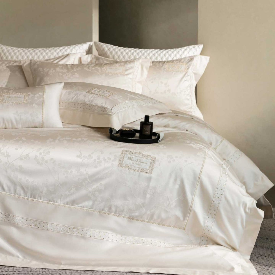 Luxurious satin bedding with jacquard floral pattern and lace trim