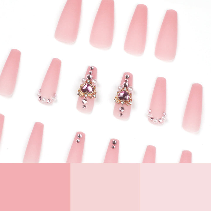 Creative artificial nails with heart-shaped decorative accents Stornfield