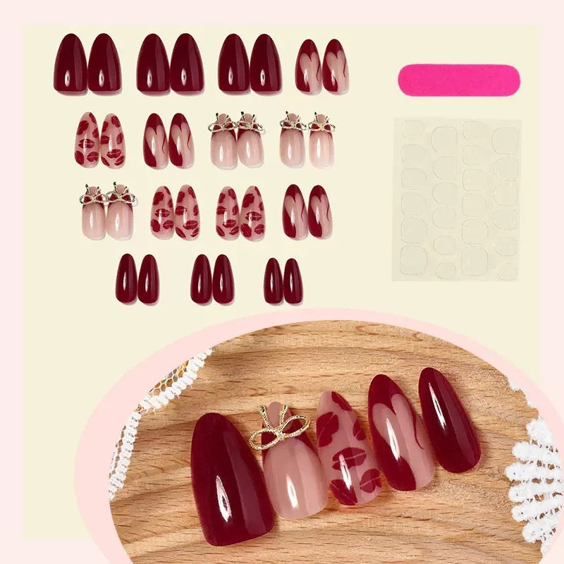 Acrylic nail set with elegant lip motifs and bow decorations Stornfield