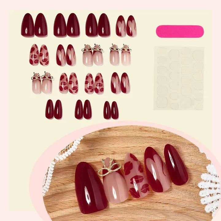 Acrylic nail set with elegant lip motifs and bow decorations Stornfield