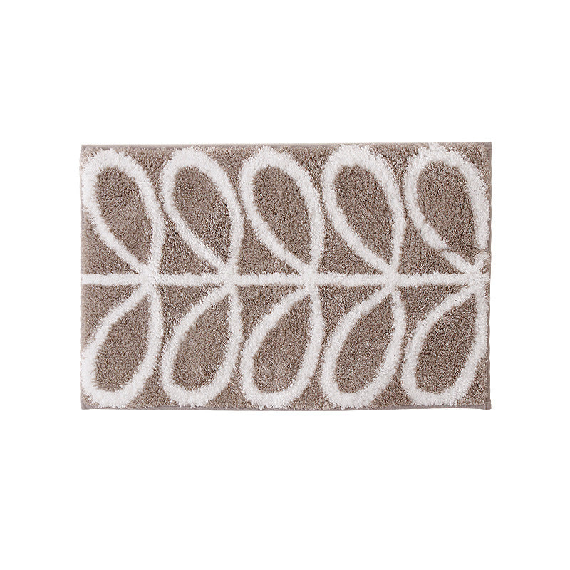 Fluffy bath mat with abstract wave pattern and non-slip back