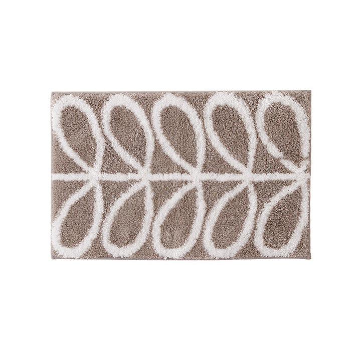Fluffy bath mat with abstract wave pattern and non-slip back