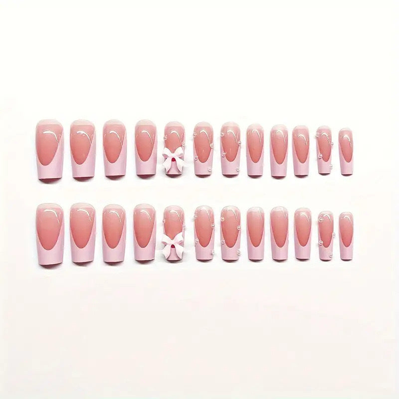 Artificial nail set with romantic bow and glitter details Stornfield