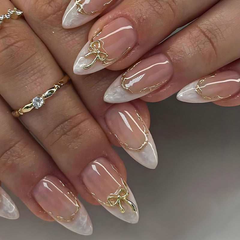 Acrylic nail set with elegant tips and delicate embellishments Stornfield