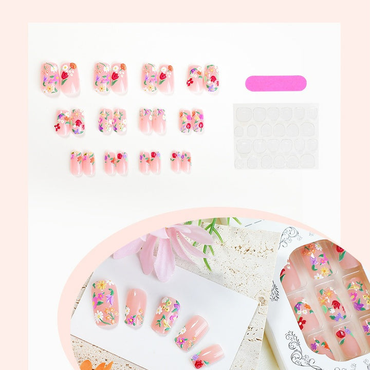 Acrylic nail set with floral motifs and glitter accents Stornfield