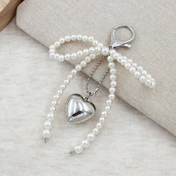 Elegant Pearl Bow Keychain Stornfield