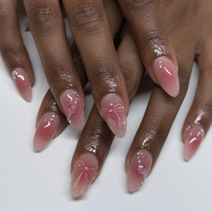 Artful nail extensions with delicate floral accents and glitter Stornfield