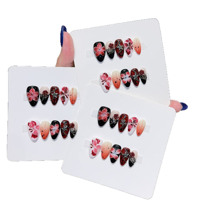 Art nail set with floral motifs and glitter accents Stornfield