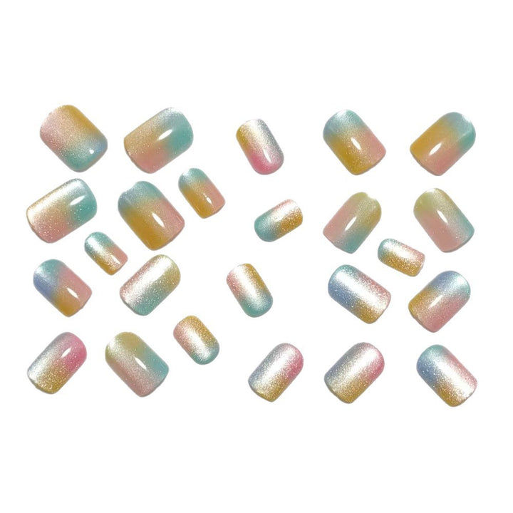 Artificial nails in delicate ombre design with glitter effects Stornfield