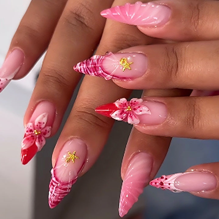 Acrylic nail set with luxurious glitter and flower accents Stornfield