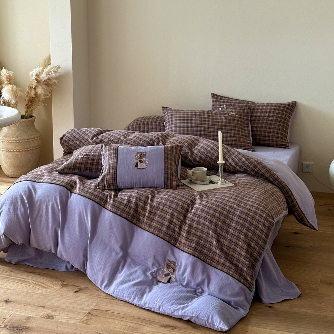 Luxurious cotton bedding set with check pattern and embroidered floral appliqués