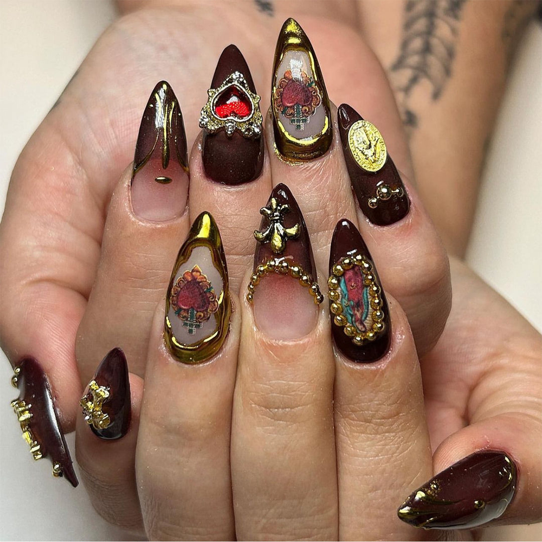 Artistic stiletto nails with detailed embellishments Stornfield