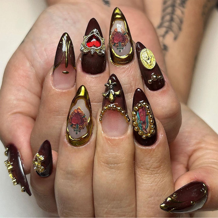 Artistic stiletto nails with detailed embellishments Stornfield