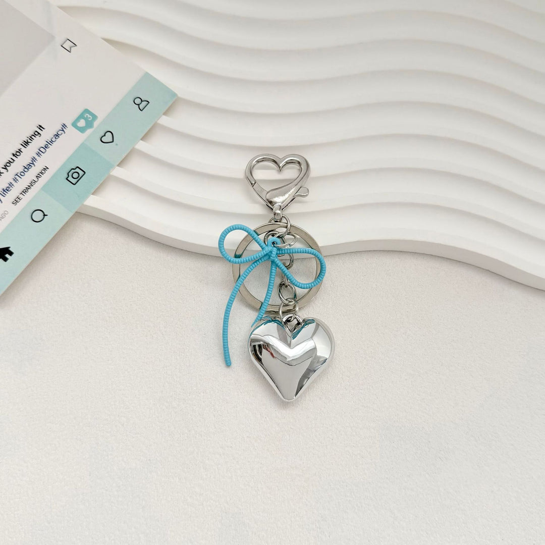 Heart-Shaped Metallic Keychain with Decorative Bow Stornfield