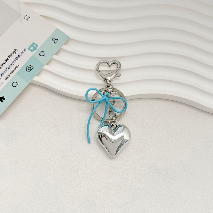 Heart-Shaped Metallic Keychain with Decorative Bow Stornfield