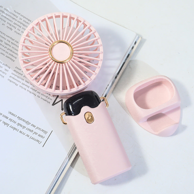 Women's Portable Hand Fan with Integrated Spray Function and USB Charging Option Stornfield