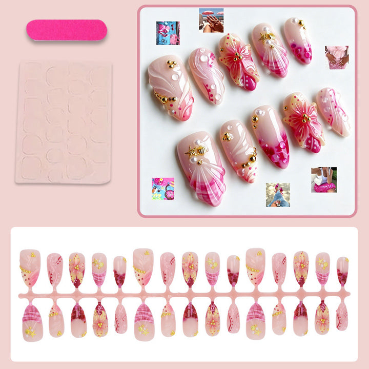 Fake nail set with floral patterns and luxurious embellishments Stornfield