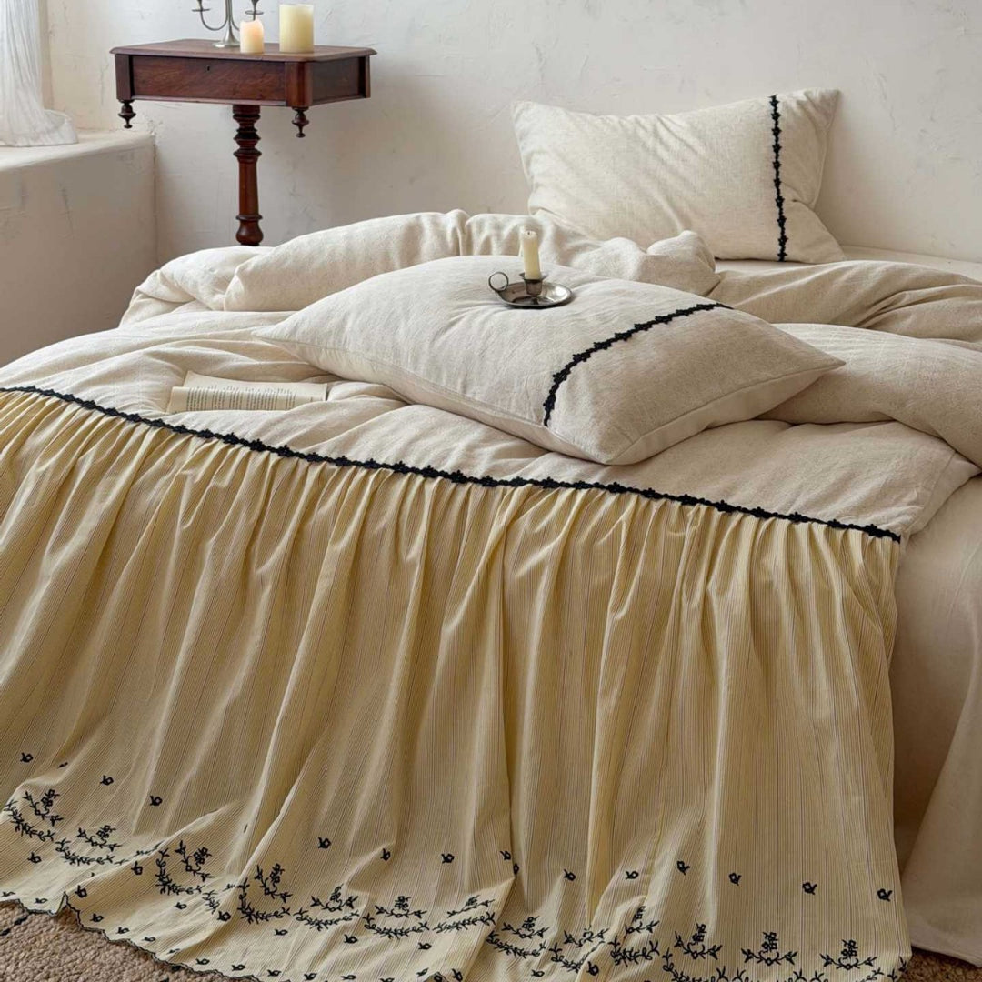 Bedding set with gathered bed skirt, embroidered trim and cotton-linen mix