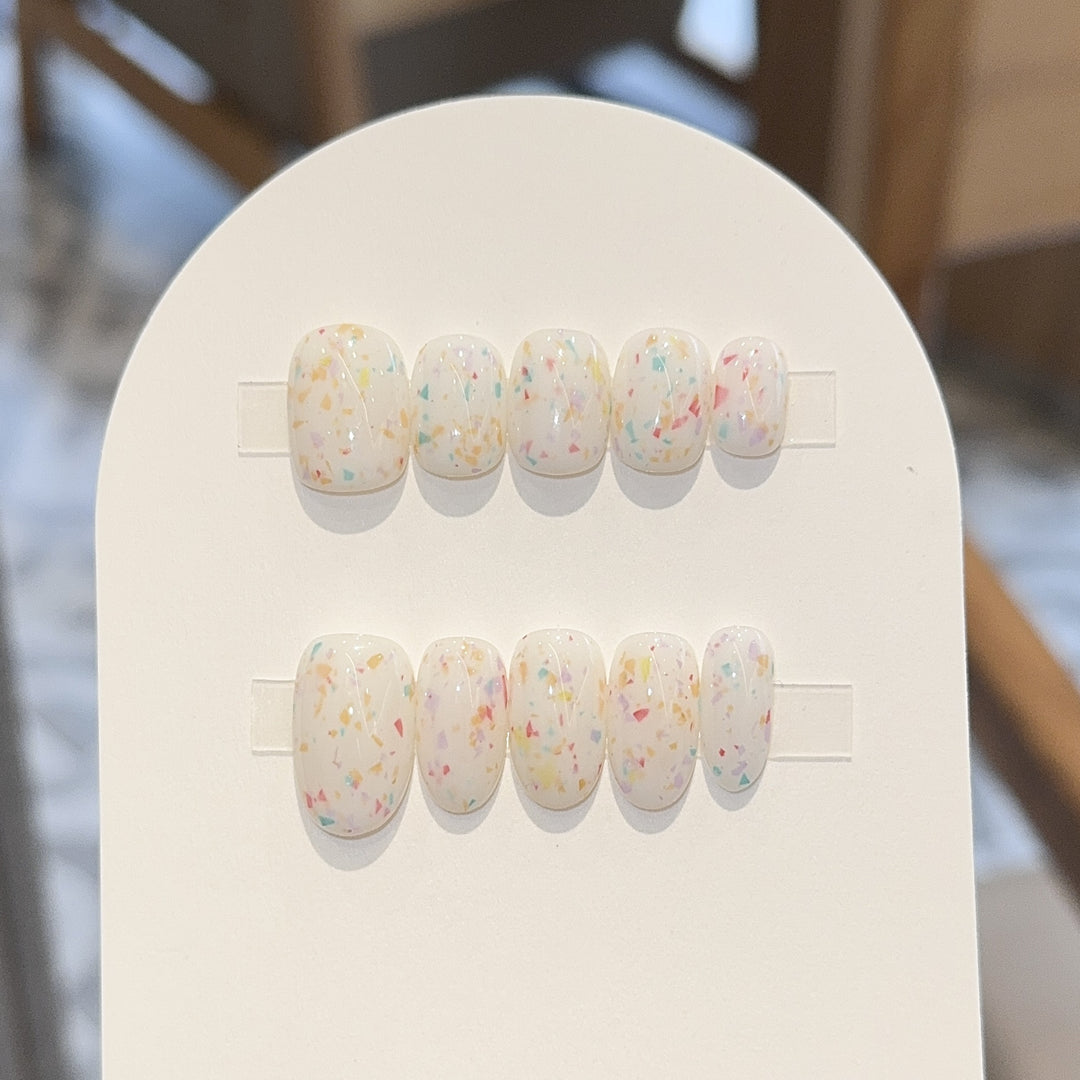 Artificial nails with cheerful sparkle design Stornfield