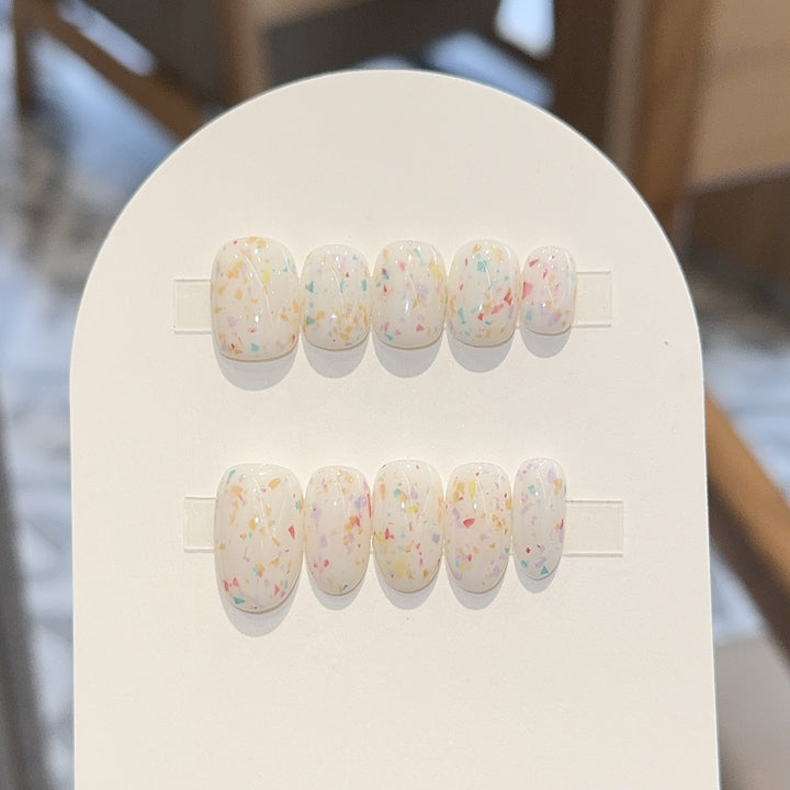 Artificial nails with cheerful sparkle design Stornfield