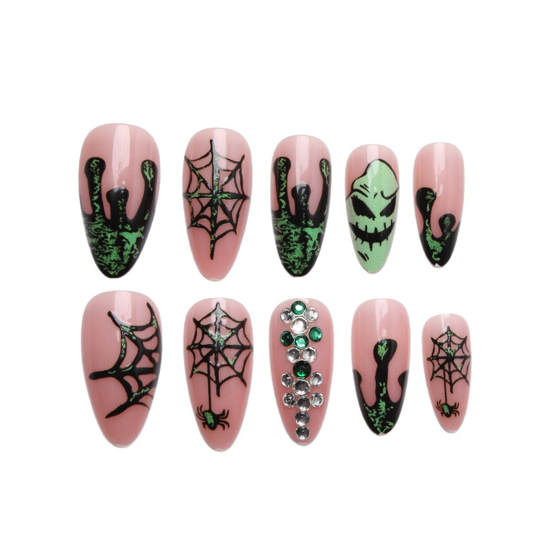 Acrylic nails with Halloween spider design and glitter accents Stornfield