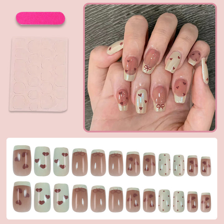 Artifical nails with romantic heart and ribbon designs Stornfield