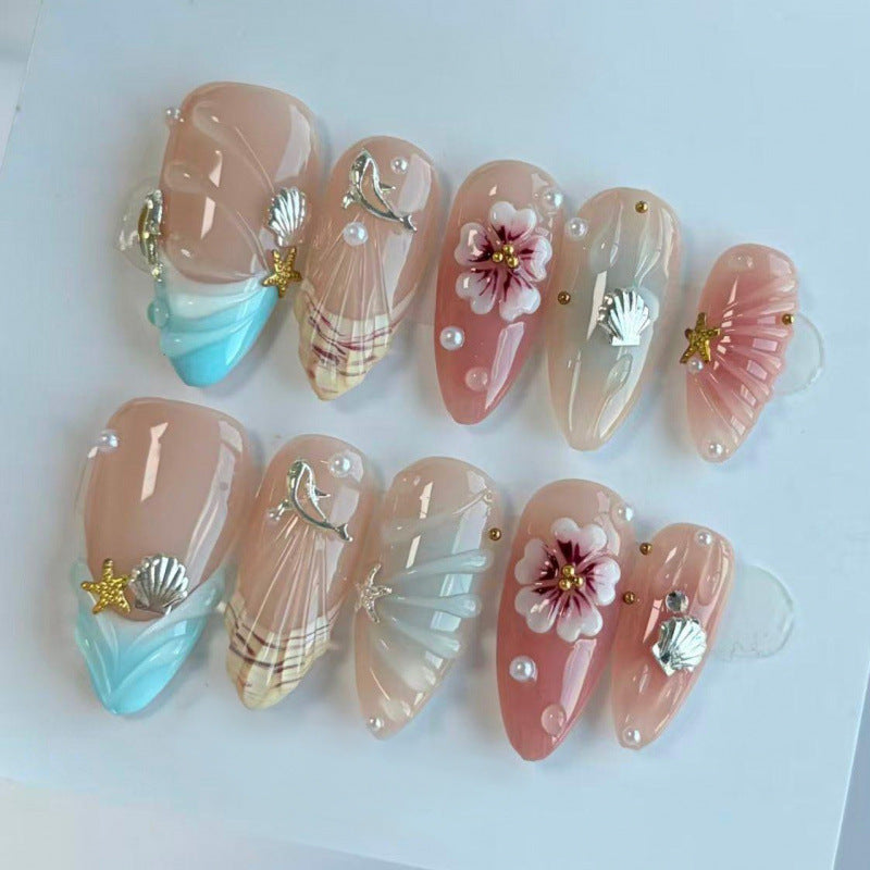 Acrylic nail set with filigree shell and flower decorations Stornfield