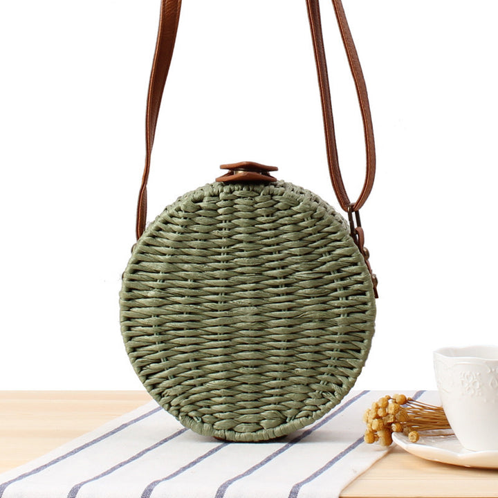 Round basket bag with leather accents Stornfield