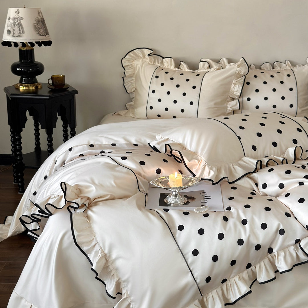 Romantic satin bedding set with ruffles, dots, and fine piping